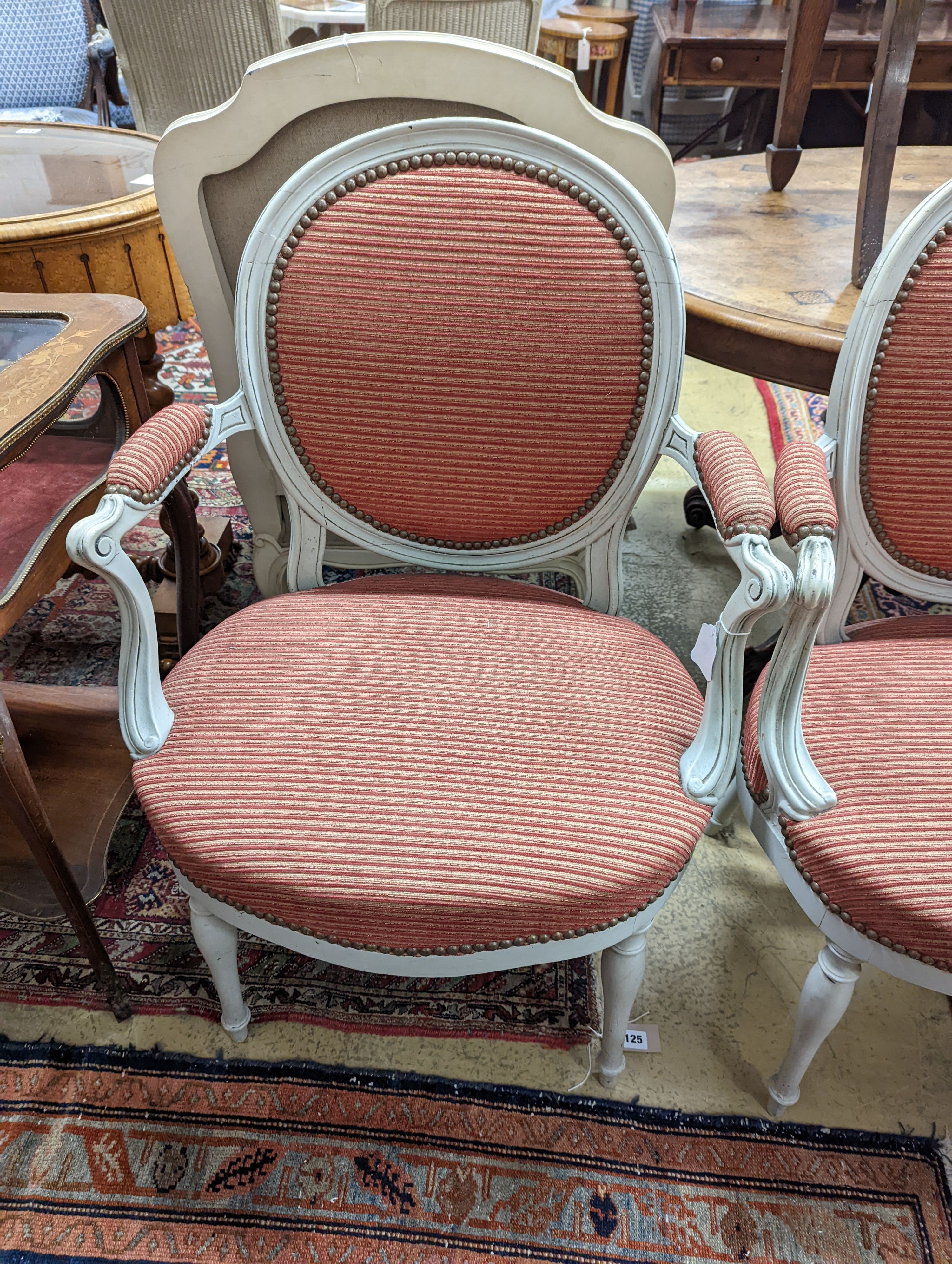 A pair of early 20th century French painted upholstered armchairs, width 59cm, depth 48cm, height 89cm